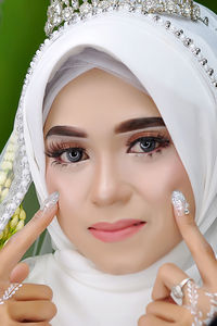 Portrait of young woman wearing hijab