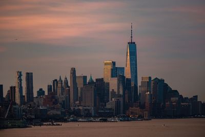 Modern buildings in city at sunset