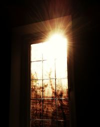 Sunlight streaming through glass window at home