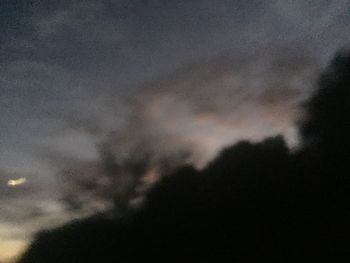 Low angle view of cloudy sky at night