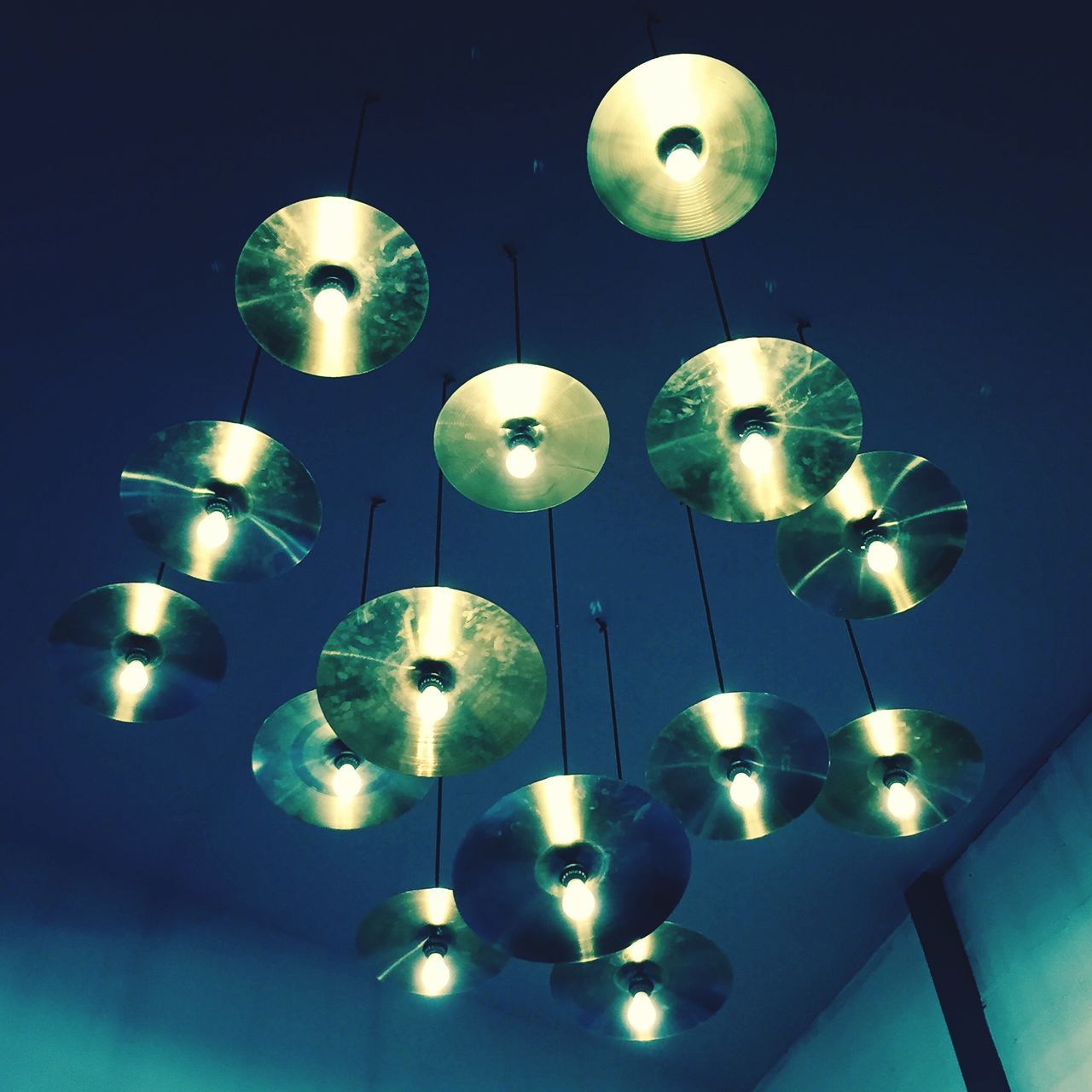 low angle view, lighting equipment, illuminated, hanging, indoors, ceiling, decoration, in a row, electricity, electric lamp, electric light, sphere, light bulb, large group of objects, repetition, light - natural phenomenon, glowing, no people, night, sky