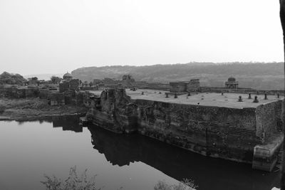 Panoramic view of river and buildings against clear sky