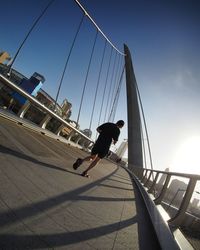 Low angle view of woman standing in city