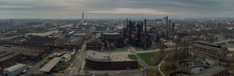 High angle view of buildings in city against sky