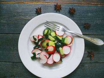 High angle view of fruits in plate on table