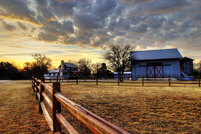 Scenic view of field against sky during sunset