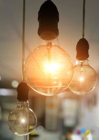 Low angle view of illuminated light bulb