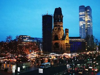 Illuminated buildings in city at night