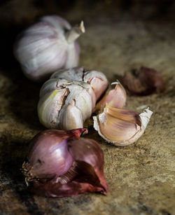 Close-up of garlic on wood