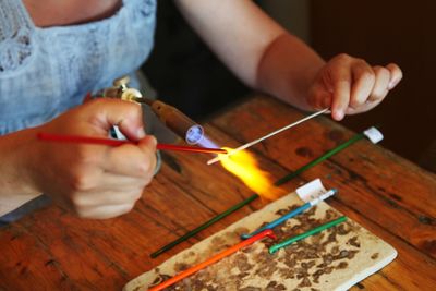 Midsection of woman working at table