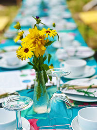 Festive table outdoor with flowers-close up