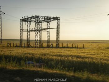 Electricity pylon on field