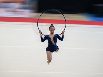 Rear view of woman walking on floor