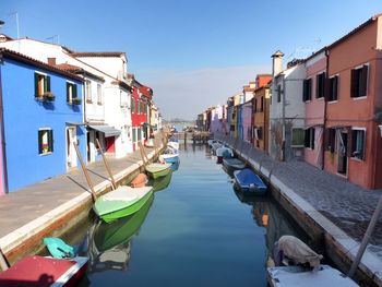 Boats moored at harbor