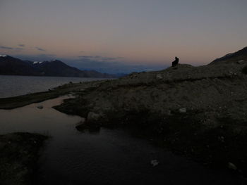 Scenic view of landscape against sky during sunset