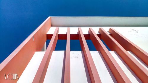 Low angle view of building against clear blue sky