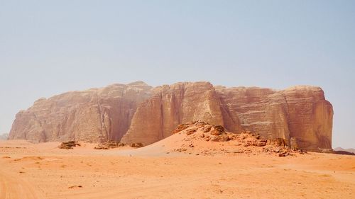 Rock formations in desert against sky