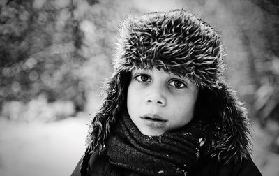 Close-up portrait of boy in snow