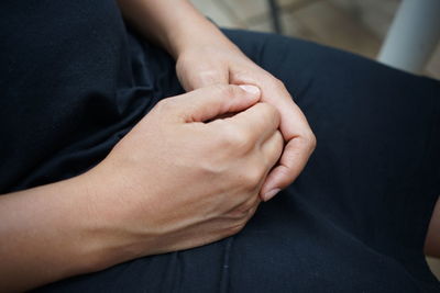 Midsection of hands of woman