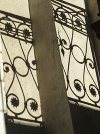 Low section of person shadow on tiled floor