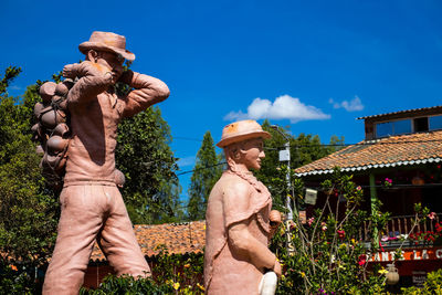 Low angle view of statue against sky