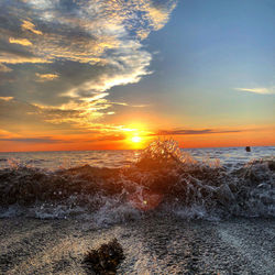 Scenic view of sea against sky during sunset