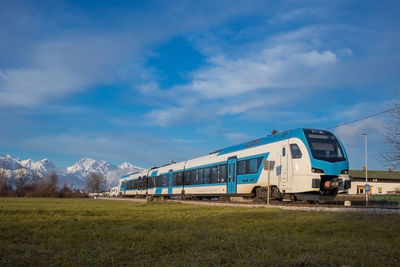 Train on field against sky
