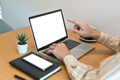 Low angle view of mobile phone on table