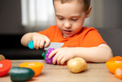 Cute boy playing with toy