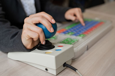 Midsection of man using sound mixer