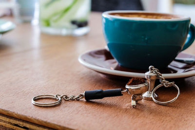 Close-up of coffee filter by cup on table