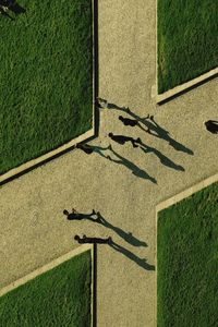 High angle view of people walking on footpath