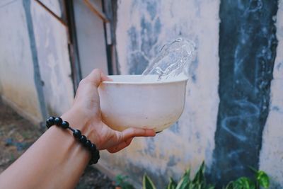 Midsection of woman holding drink