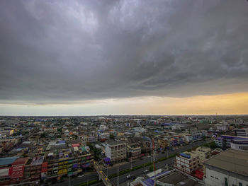 High angle view of buildings against sky during sunset