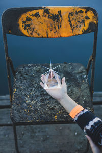 High angle view of prism on palm of hand 