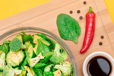 Fresh green salad of avocado, broccoli, spinach and cucumber