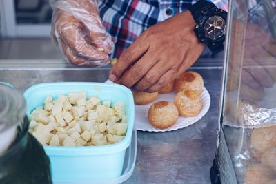 High angle view of man preparing food