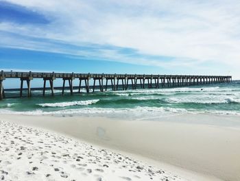 Pier over sea against sky