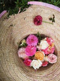 High angle view of pink rose bouquet in basket