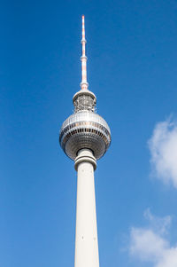 Low angle view of communications tower against sky