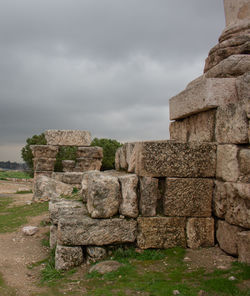 Old ruins of building against cloudy sky