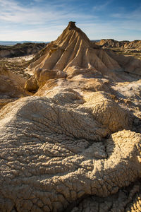 Scenic view of arid landscape against sky. bardenas reales. spain