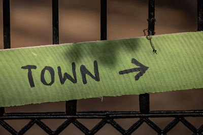 The inscription town on a green wooden board.