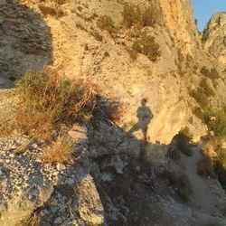 Shadow of people on rock