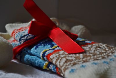 Close-up of sock tied with ribbon