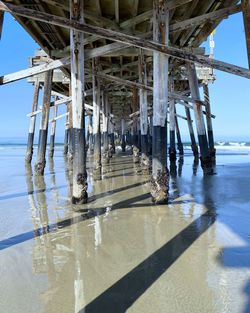 Pier over sea against sky