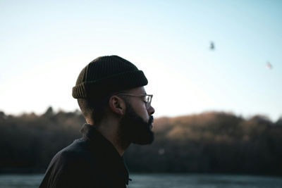 Portrait of man wearing sunglasses against sky