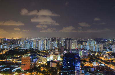 High angle view of illuminated city buildings against sky