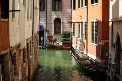 View of boats moored at canal