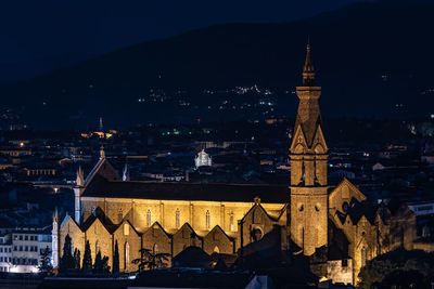 Illuminated buildings in city at night